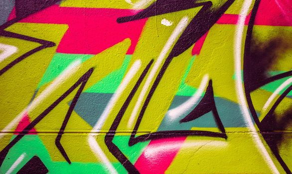 Detail of a colorful graffiti on a wall, abstract background