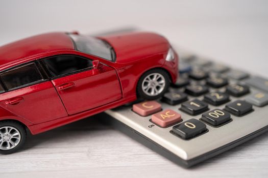 Car on calculator, Car loan, Finance, saving money, insurance and leasing time concepts.