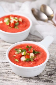 Watermelon tomato gazpacho in bowls. Traditional Spanish cold soup.