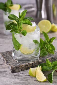 Refreshing summer alcoholic cocktail mojito with ice, fresh mint and lime