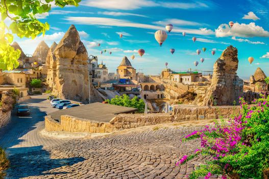 Hot air balloons at sunset in Goreme village, Cappadocia, Turkey