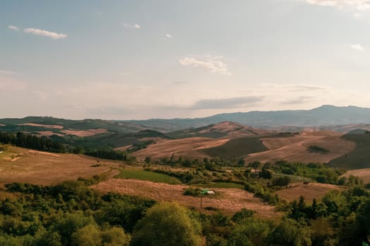 Panoramic view of the Tuscan countryside with the characteristic colors of its hills, Tuscany, Italy.