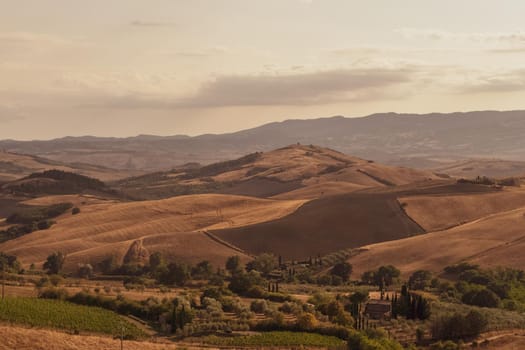 Panoramic view of the Tuscan countryside with the characteristic colors of its hills, Tuscany, Italy.