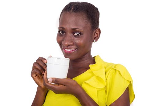 Happy face of young woman drinking coffee indoors.