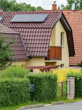 Renewable energy from Sun. Modern house with solar panels on the roof 