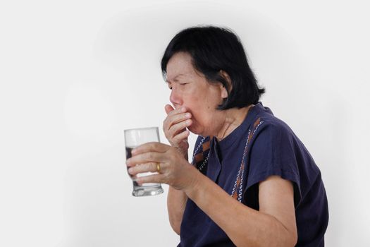 elderly woman Choking a water drink after take  medicine ,isolated on white background.