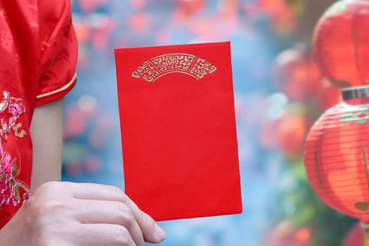 chinese woman holding new year red envelope or hong bao