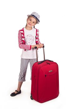 little girl with a suitcase and a Pisa tower made of cardboard