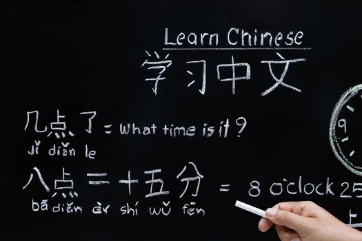 Learning chinese to tell time in class room.