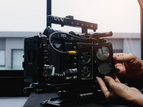 Open the cooling fan cover of the movie camera to clean and repair.