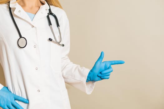 Image of female doctor pointing.