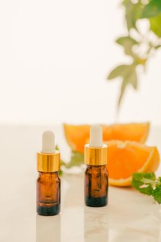 Brown Bottle with lemon, orange, tangerine and vitamin C. on white background.