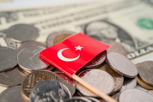 Stack of coins with Turkey flag on USA America dollar banknotes.