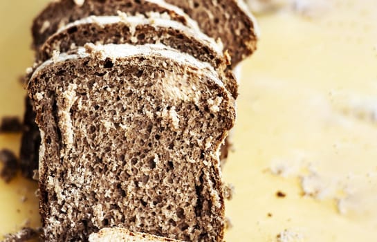Close-up view of some slices of fresh rye bread. Healthy food and source of fiber. Bakery product