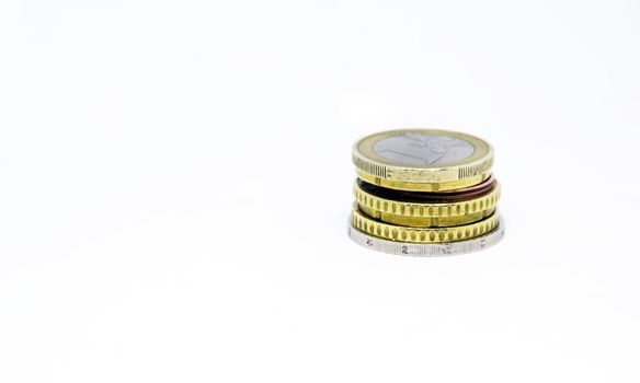 Various euro coins stacked. Coins isolated on a white background. Economics and finance. European Union currency.