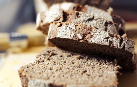 Close-up view of some slices of fresh rye bread. Healthy food and source of fiber. Bakery product