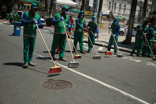 salvador, bahia, brazil - september 7, 2021: street sweeper are seen while cleaning a street in downtown Salvador.
