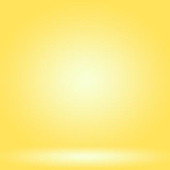 Abstract solid of shining yellow gradient studio wall room background