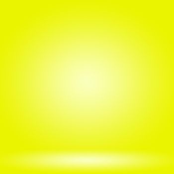 Abstract solid of shining yellow gradient studio wall room background