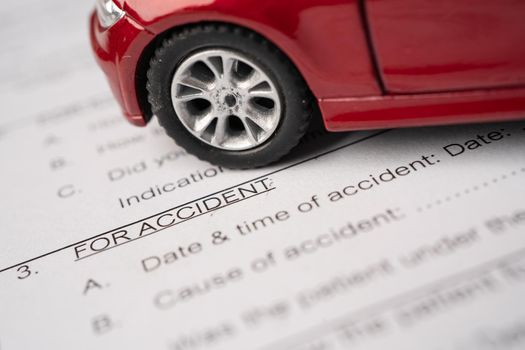 Car on Insurance claim accident form, Car loan, insurance and leasing time concepts.