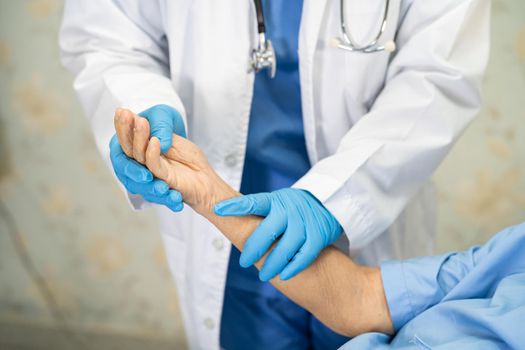 Doctor using stethoscope to checking Asian senior or elderly old lady woman patient wearing a face mask in hospital for protect infection Covid-19 Coronavirus.