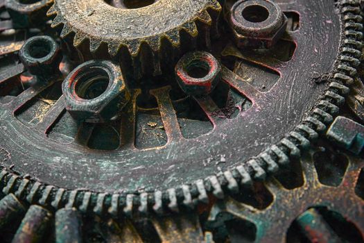 Machine gear, metal cogwheels, nuts and bolts.Selective focus