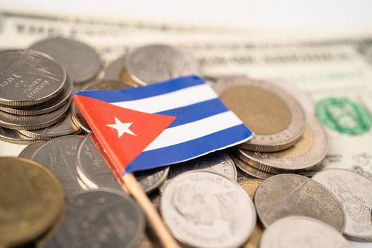 Stack of coins with Cuba flag on white background.