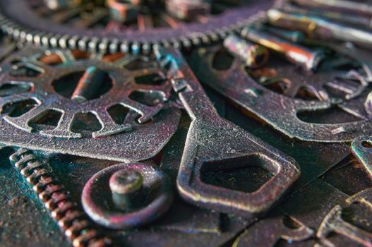 Abstract background of nuts, metal products, bolts, key, studs, washers. Selective focus, blurred background