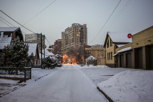 A man walks through a winter city
