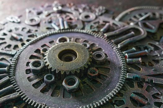 Machine gear, metal cogwheels, nuts and bolts.Selective focus
