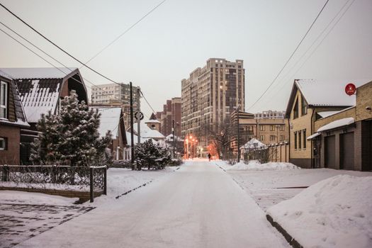 A man walks through a winter city
