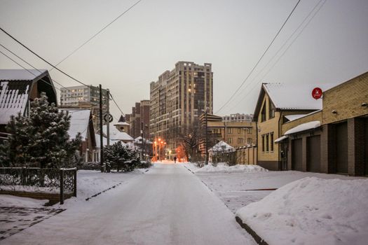 A man walks through a winter city
