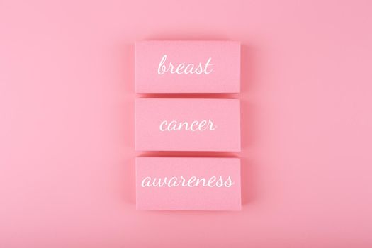 Bright pink minimal Breast cancer awareness concept. Creative composition for cancer awareness campaign in October, postcard, invitation or banner