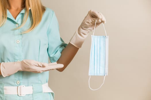 Image of medical nurse showing surgical mask.