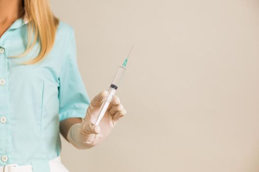 Image of medical nurse holding injection.