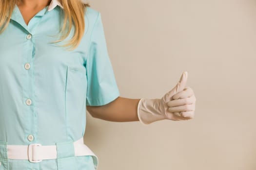 Image of medical nurse showing thumbs up.