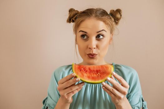 Portrait of happy cute woman enjoys eating watermelon.Toned image.