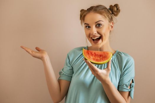 Portrait of happy cute woman enjoys eating watermelon and gesturing.Toned image.