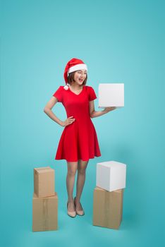 Asian Woman with Christmas Santa hold christmas gift.
