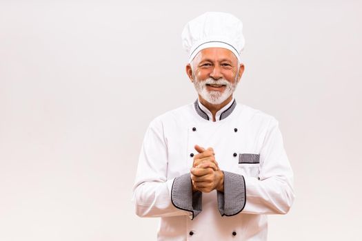 Portrait of  senior chef preparing to cook.