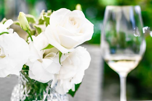 Wedding decoration, table decor and floral beauty, bouquet of white roses in luxury restaurant, beautiful flowers from summer garden.