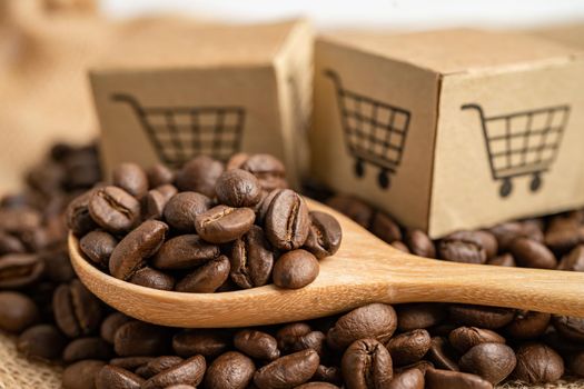 Box with shopping cart logo symbol on coffee beans, Import Export Shopping online or eCommerce delivery service store product shipping, trade, supplier concept.