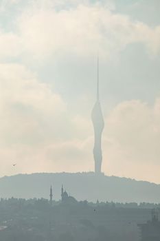 istanbul,turkey-june 29,2021.camlica tv tower and foggy landscape in the morning and istanbul city.