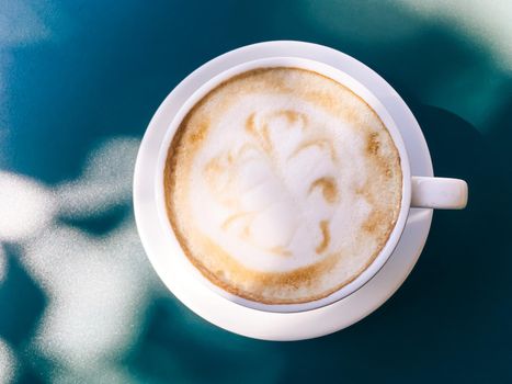 Cappuccino in summer cafe outdoors.