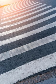 Crosswalk on the street in the city, crosswalk zebra crossing in the city for the safety of people walking across the road.