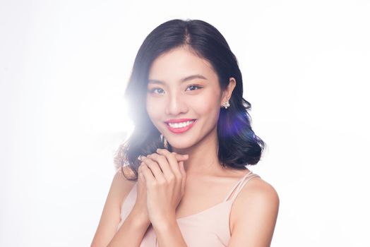 Glamour portrait of beautiful ASIAN woman model with nice makeup and romantic wavy hairstyle.