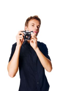 Young man with camera isolated on white background