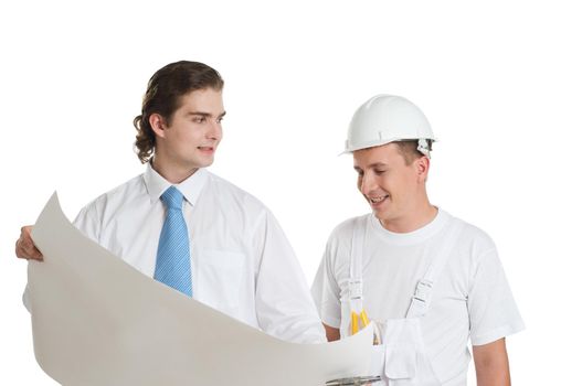 Young engineer and worker discussing large blueprint