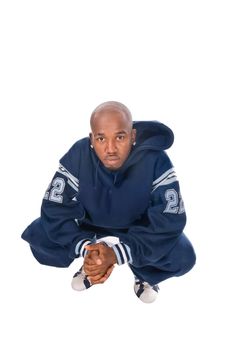 Cool young hip-hop dancer on white background