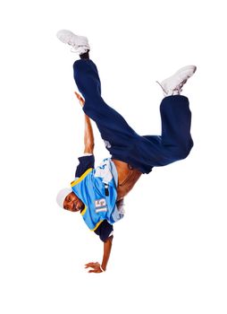 Hip-hop young man making cool move on white background